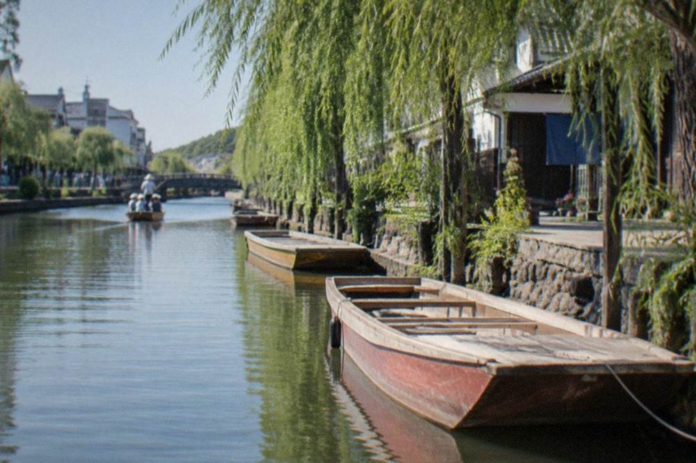 Wooden river boats moored along a canal in Yanagawa, a day trip destination from Fukuoka