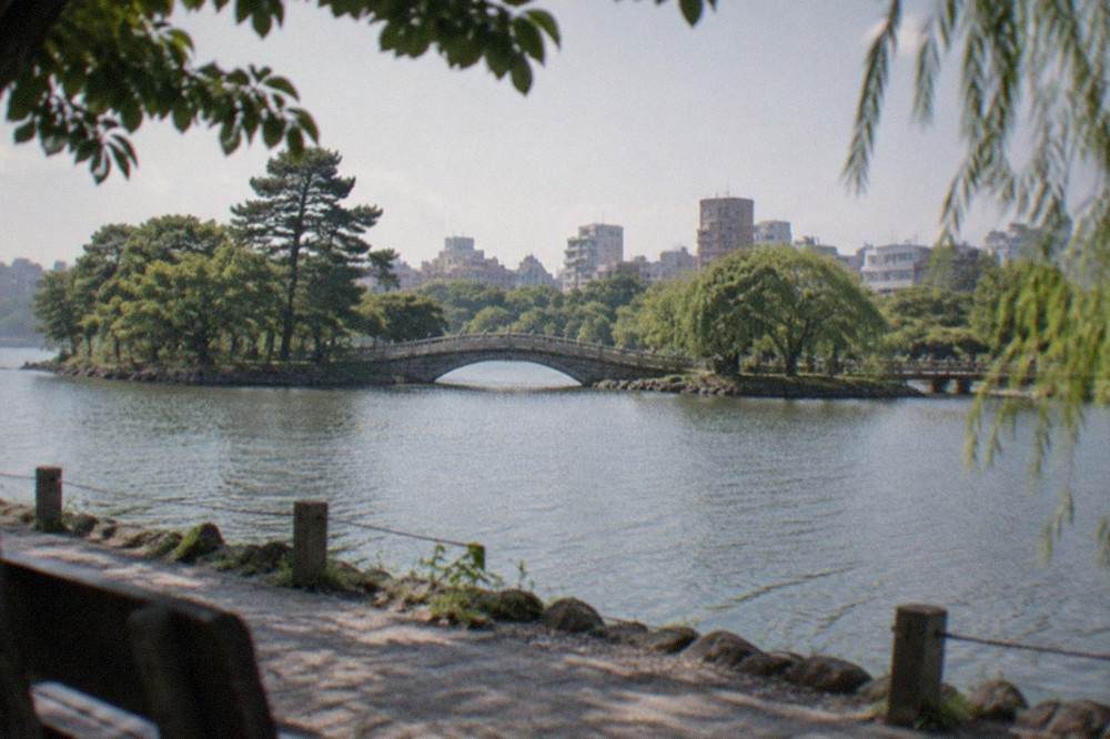 The pond and stone bridge of Ohori Park in Fukuoka on a calm afternoon