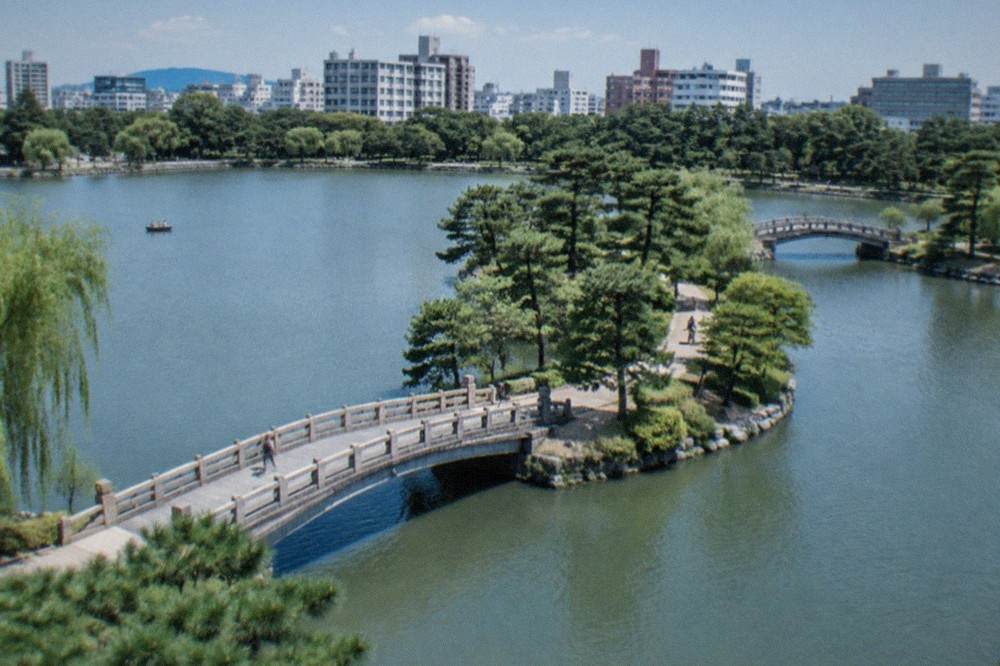 The stone bridges and pine-lined pond of Ohori Park in central Fukuoka
