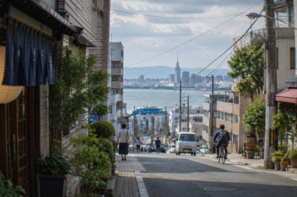 Fukuoka city skyline across Hakata Bay with the Genkai Sea on the horizon