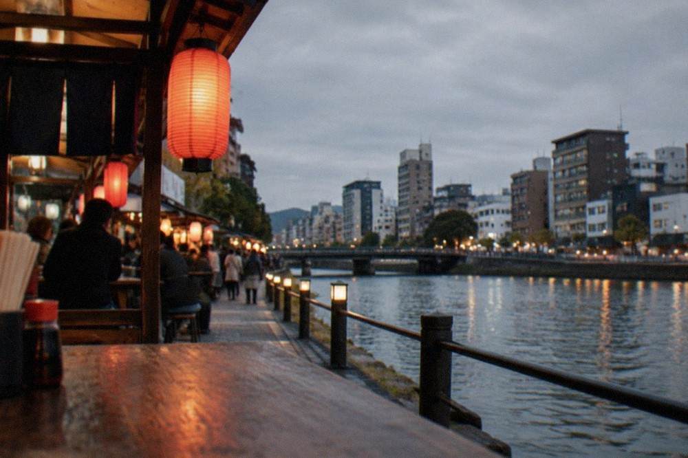 Lantern-lit food stalls along the Naka River in the Nakasu district at night
