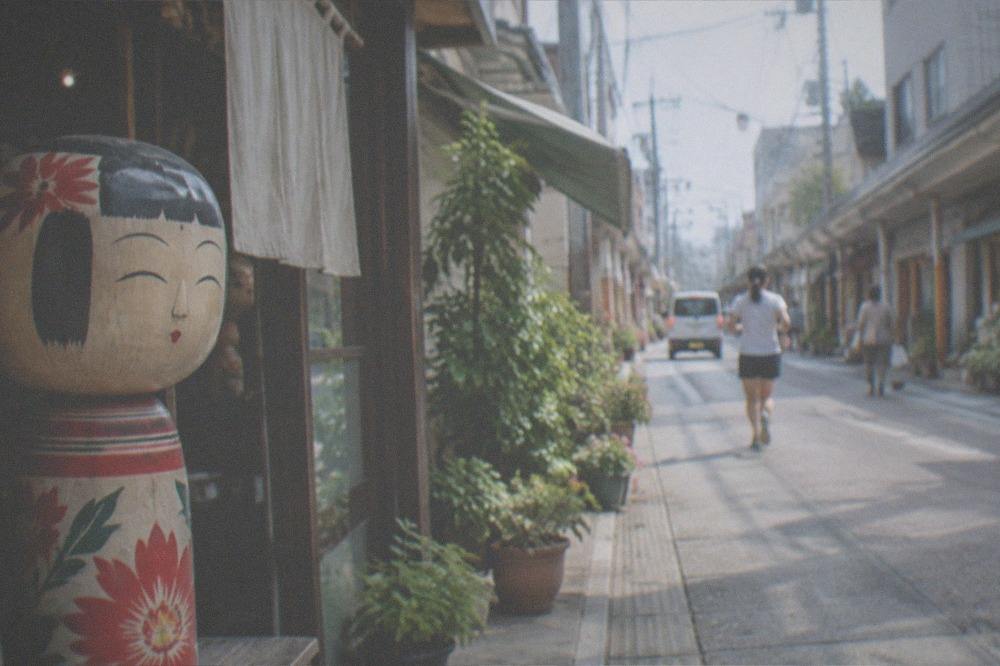 A painted Hakata doll figure displayed in a workshop