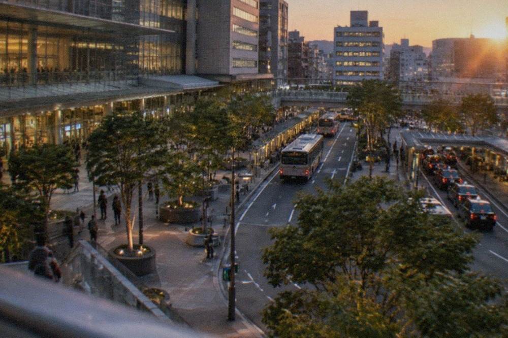 Evening view of illuminated buildings around Hakata Station in Fukuoka