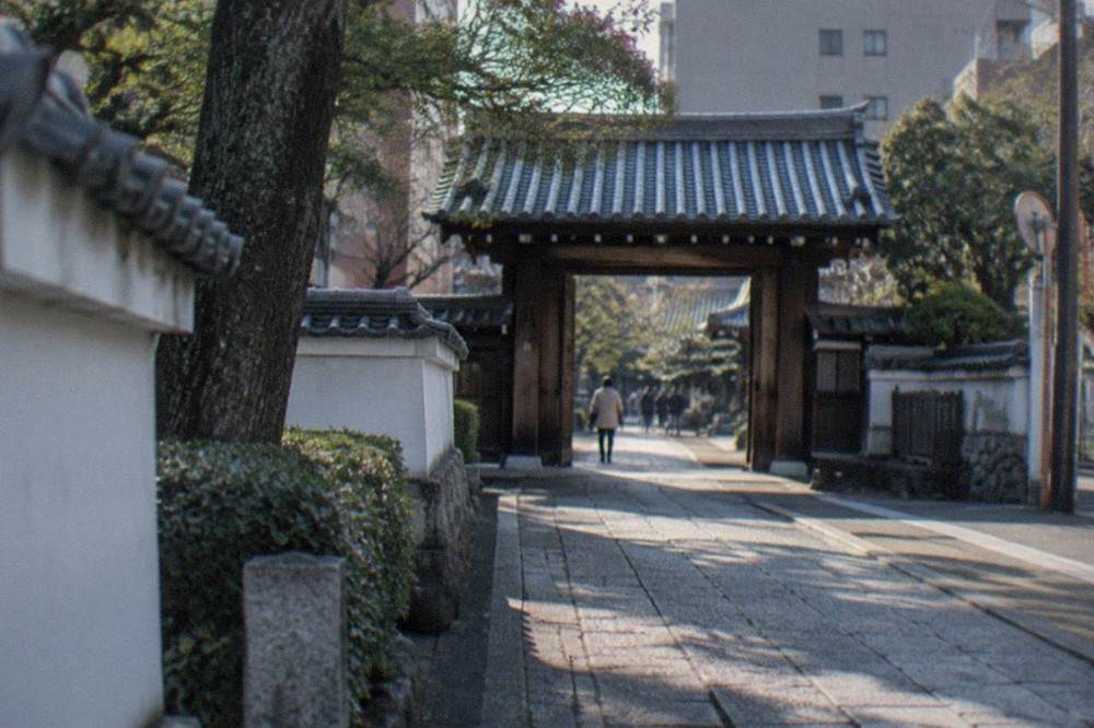 Stone path leading to a Zen temple gate in Hakata old town