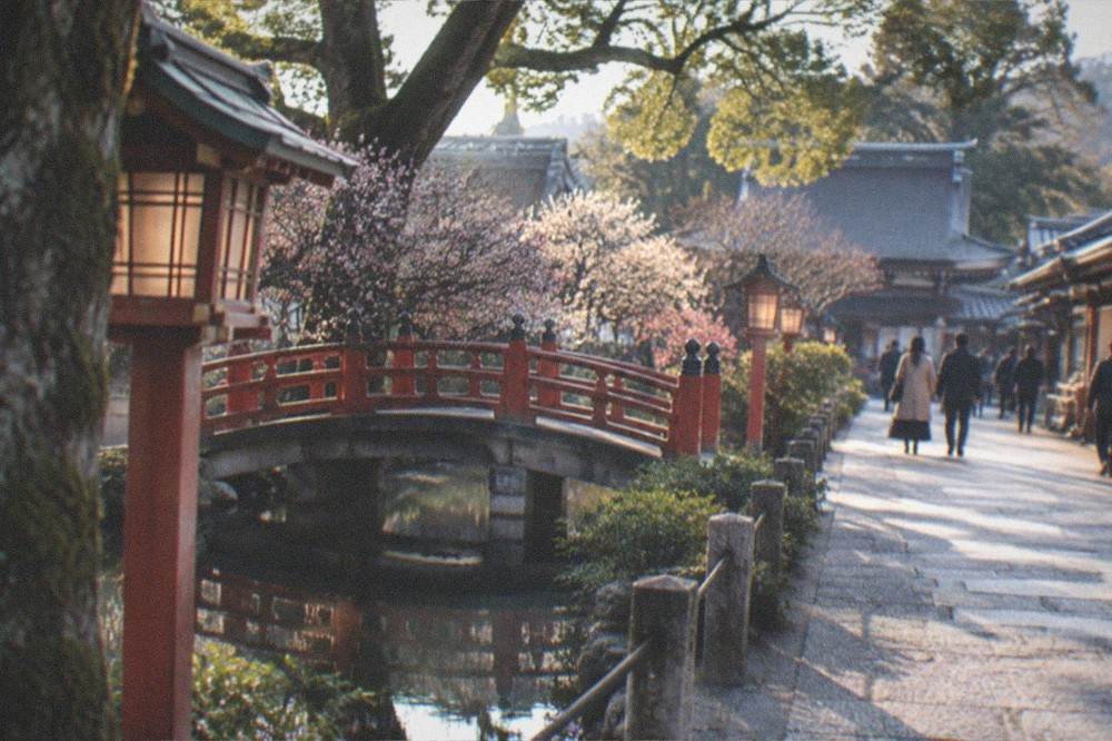 Evening light on a quiet shrine street with lanterns and closed shopfronts