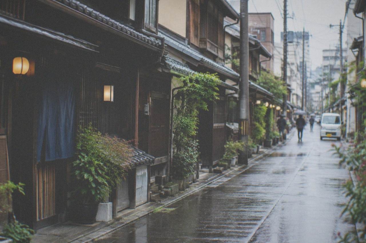 Restored traditional wooden machiya townhouses along a quiet street in Hakata, Fukuoka