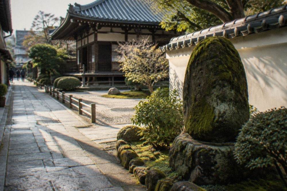 Moss covered stone monument beside a temple courtyard wall