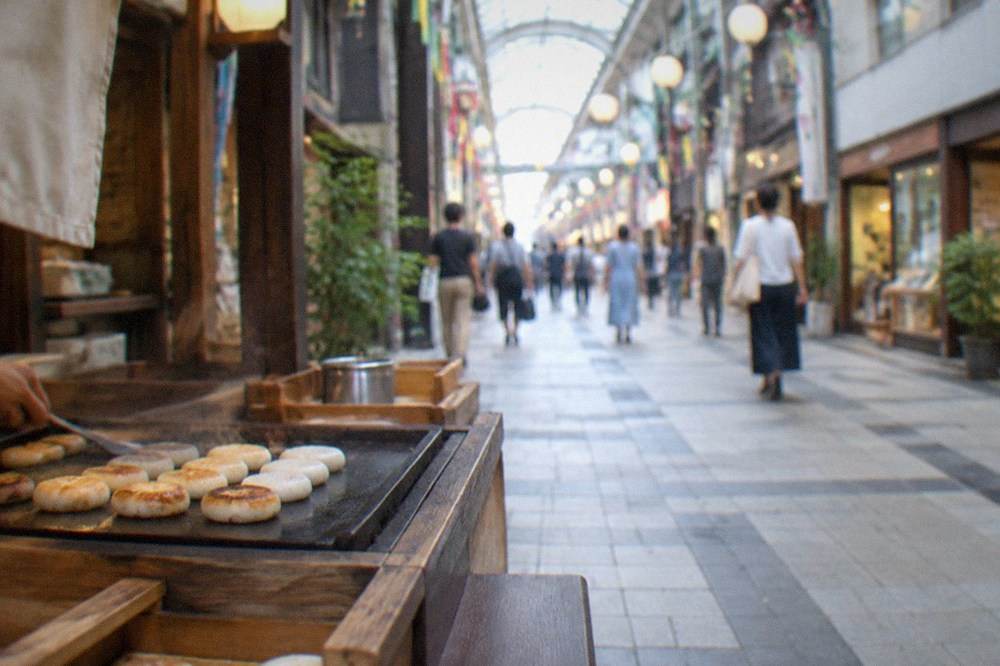Small traditional confectionery counter with rice cakes grilling on a hot plate