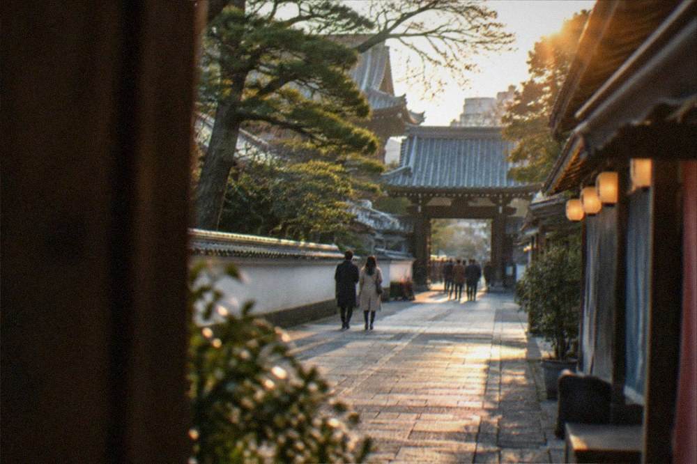 Lanterns glowing along a covered shopping arcade in the evening