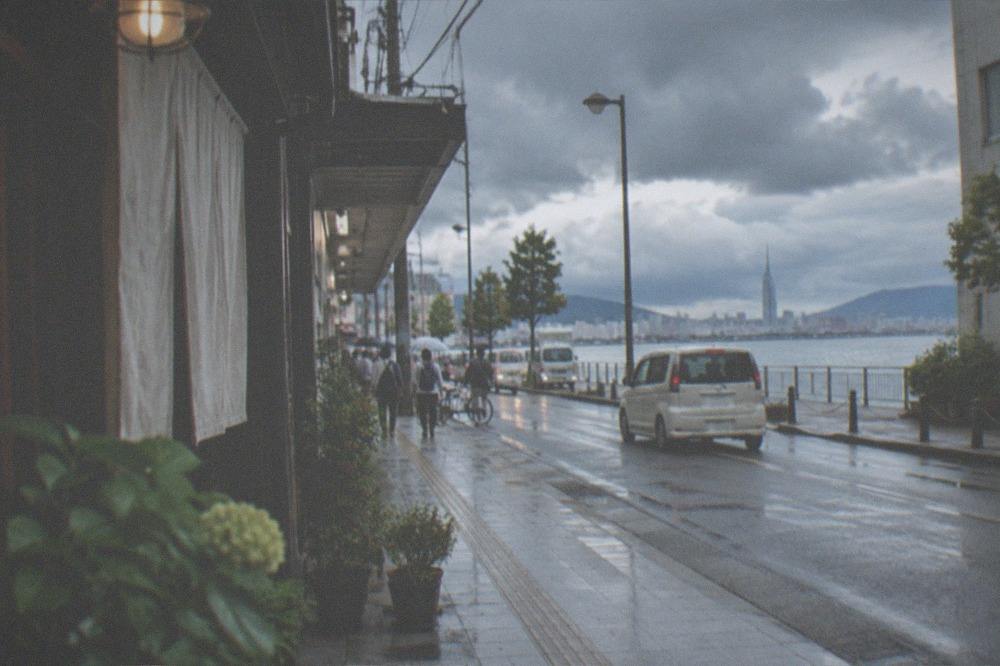 Dark rain clouds over Hakata Bay and the Fukuoka waterfront skyline