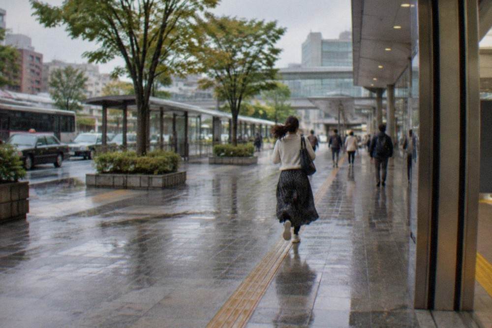 Elevator doors opening onto a clean modern subway platform in Fukuoka