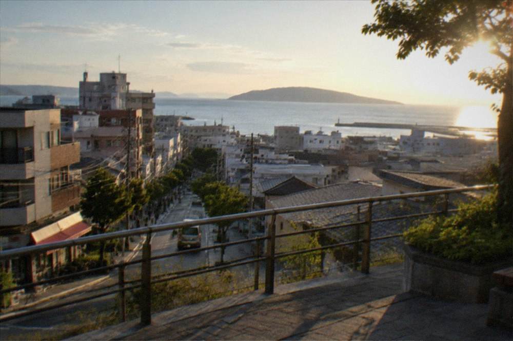 Coastal viewpoint with a wide paved observation deck above a calm sea