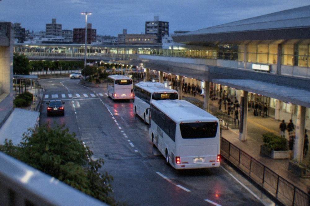 The domestic terminal forecourt at Fukuoka Airport with buses waiting at the kerb