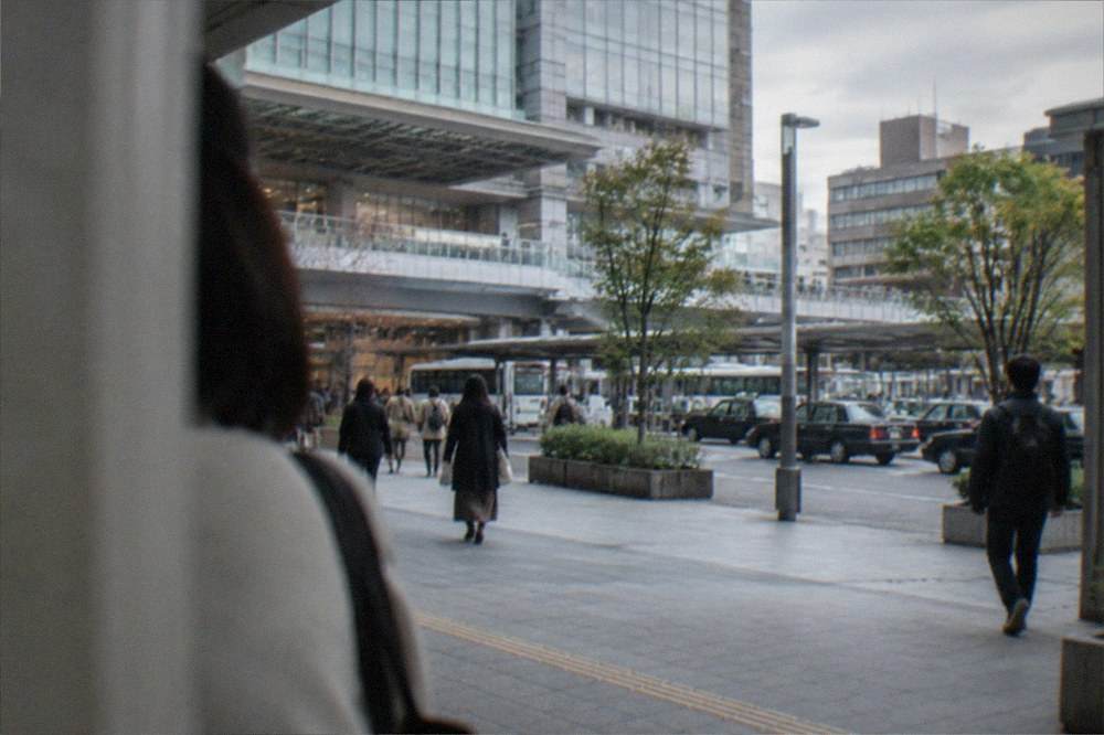 A clean modern subway station platform with a train waiting at the doors