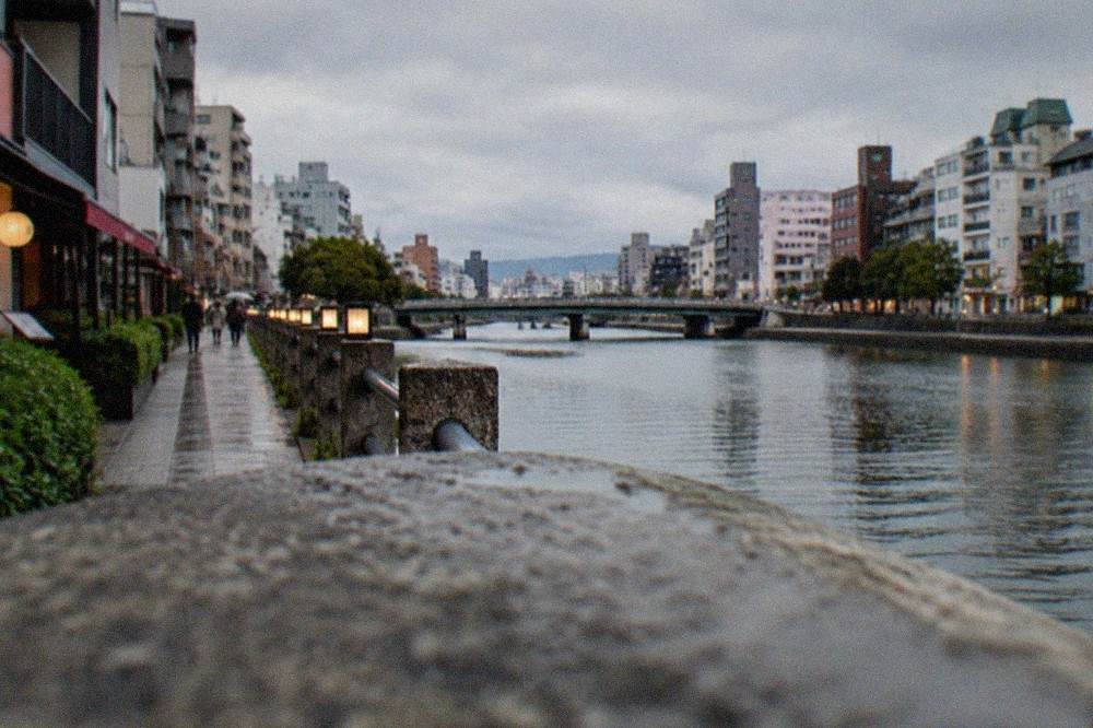 Neon signs reflecting on the Naka River beside the Nakasu entertainment district