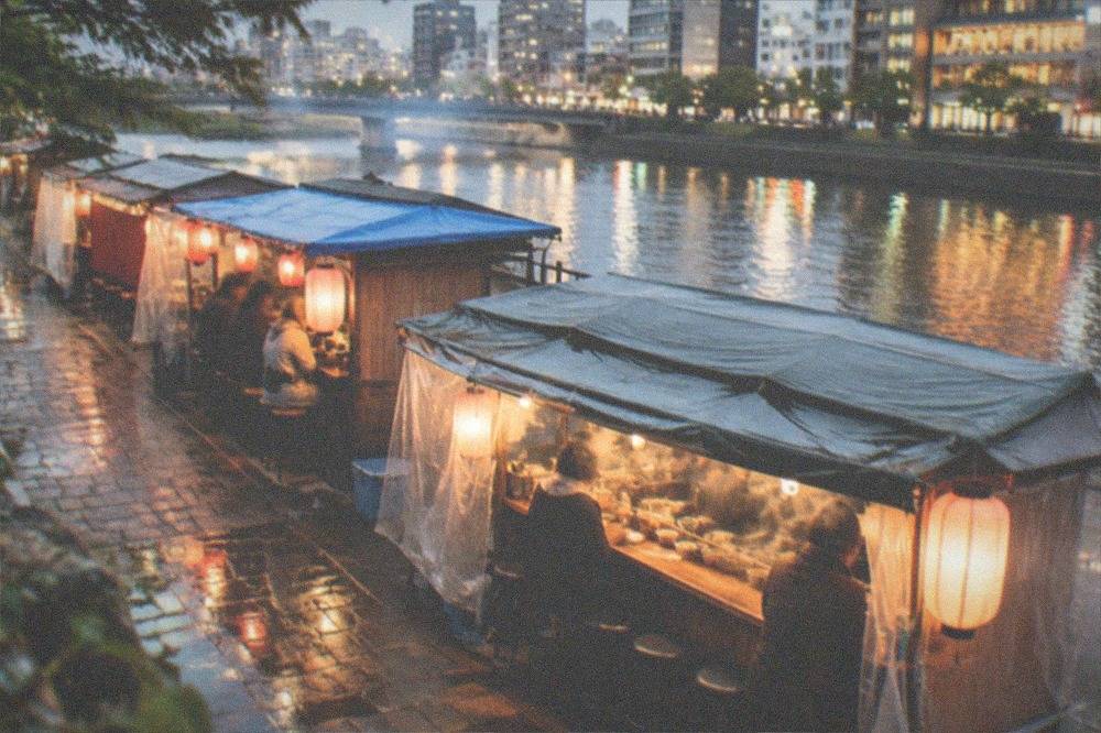 Izakaya interior with warm lanterns and dishes on a wooden counter