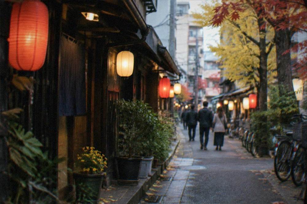 A lantern-lit alley of small bars and restaurants in a Fukuoka entertainment district at night