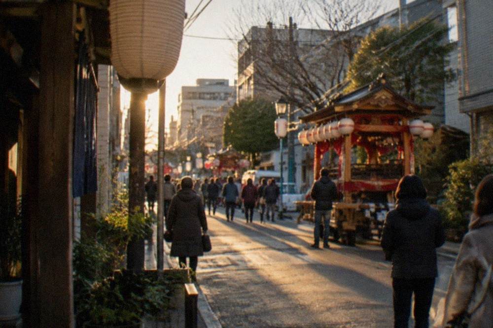 Wooden festival floats and shrine lanterns under a winter sky in Hakata