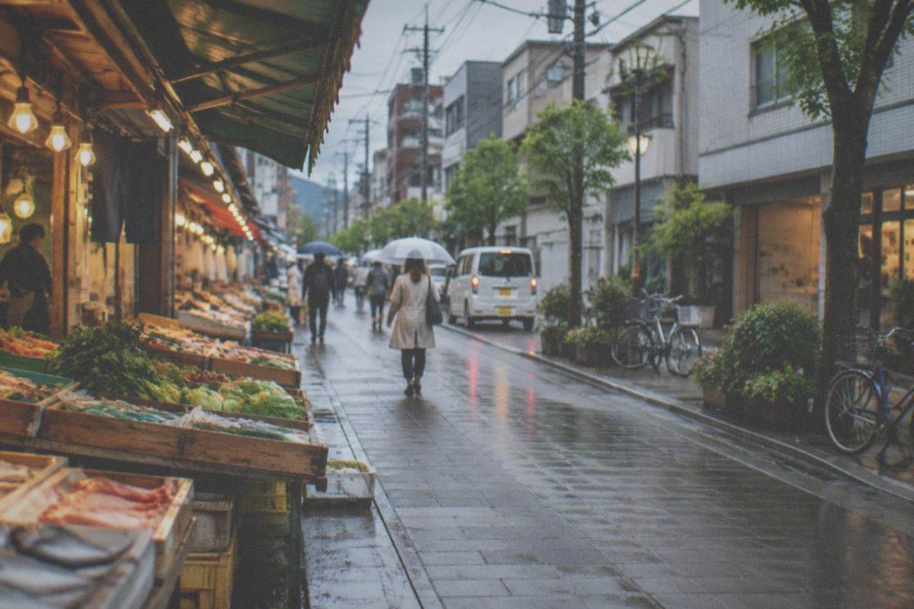 Covered market stalls with fresh vegetables and seafood displayed in wooden trays under warm lights