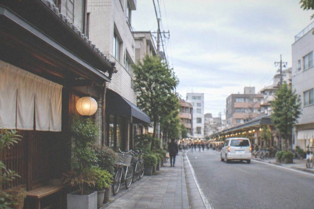 Hakata's old streets with traditional machiya facades under an evening sky