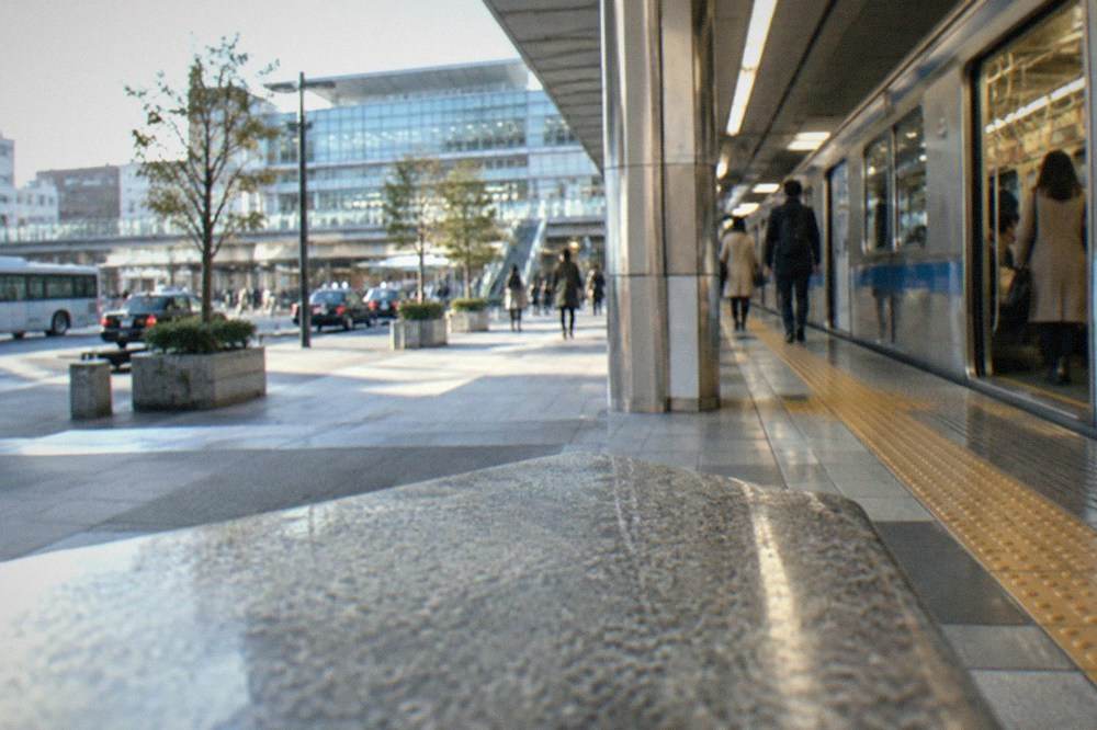 Fukuoka city subway platform with a train waiting at the doors-open position