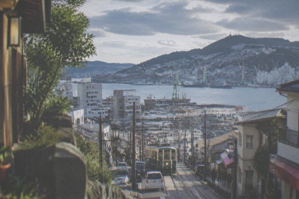 Harbour view over Nagasaki with hillsides of houses descending to the water