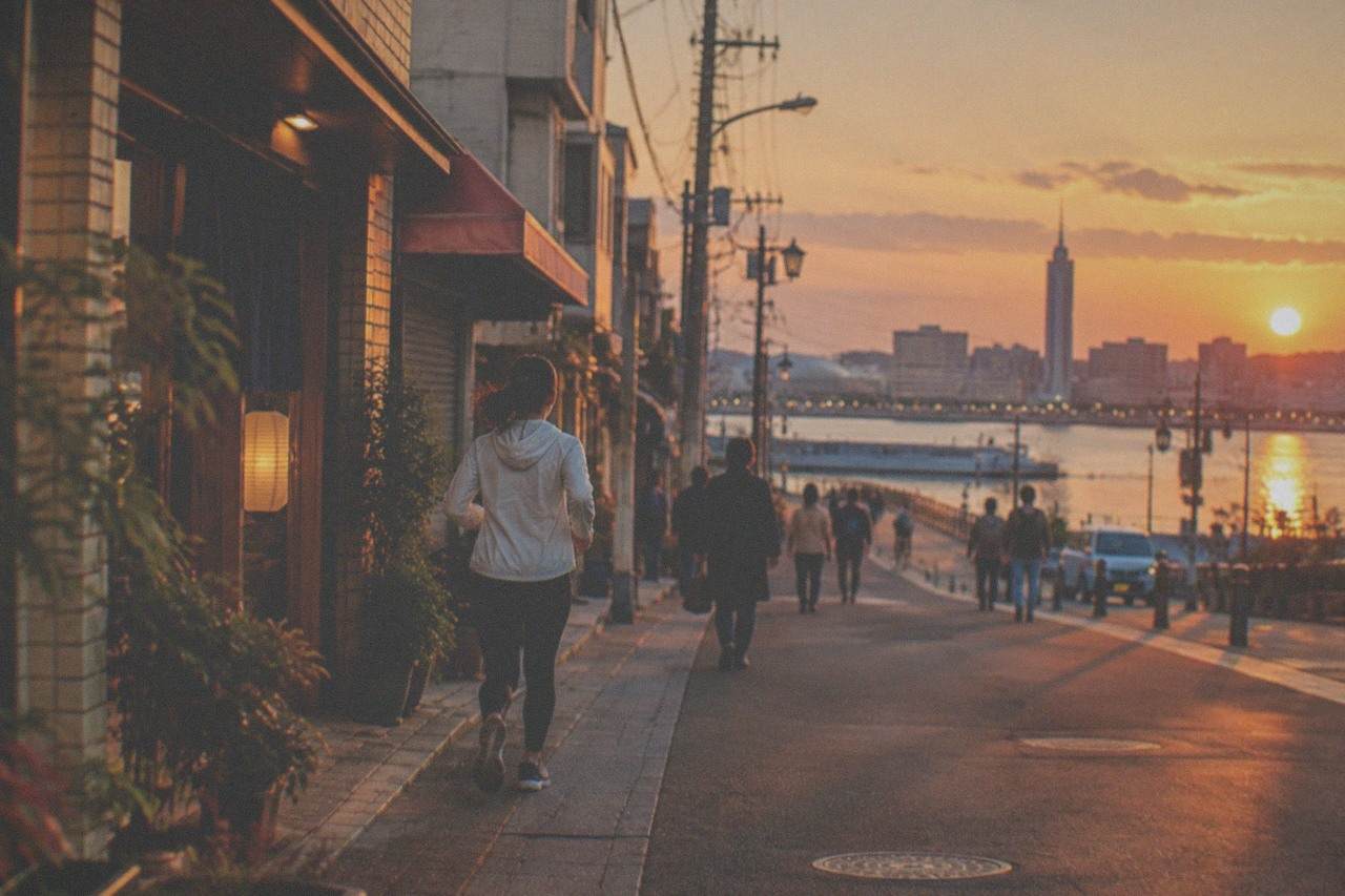 Hakata ward skyline and Hakata Bay at dusk with illuminated buildings along the waterfront