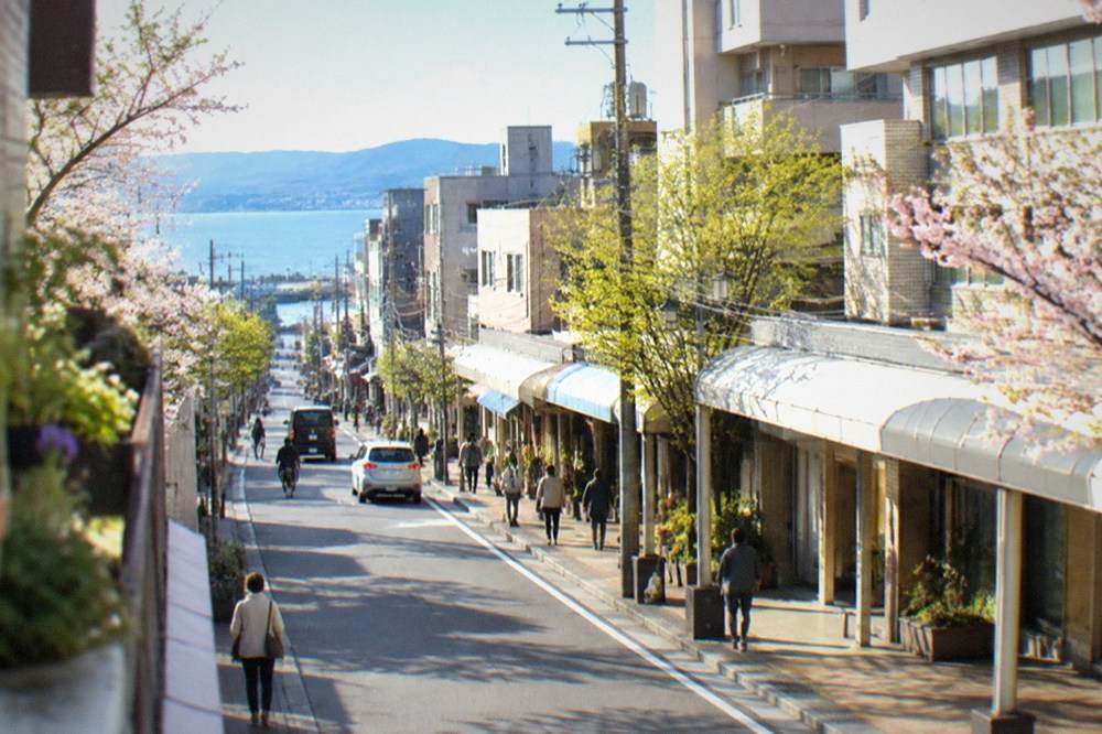 Blue spring sky over Hakata Bay with calm water and distant hills