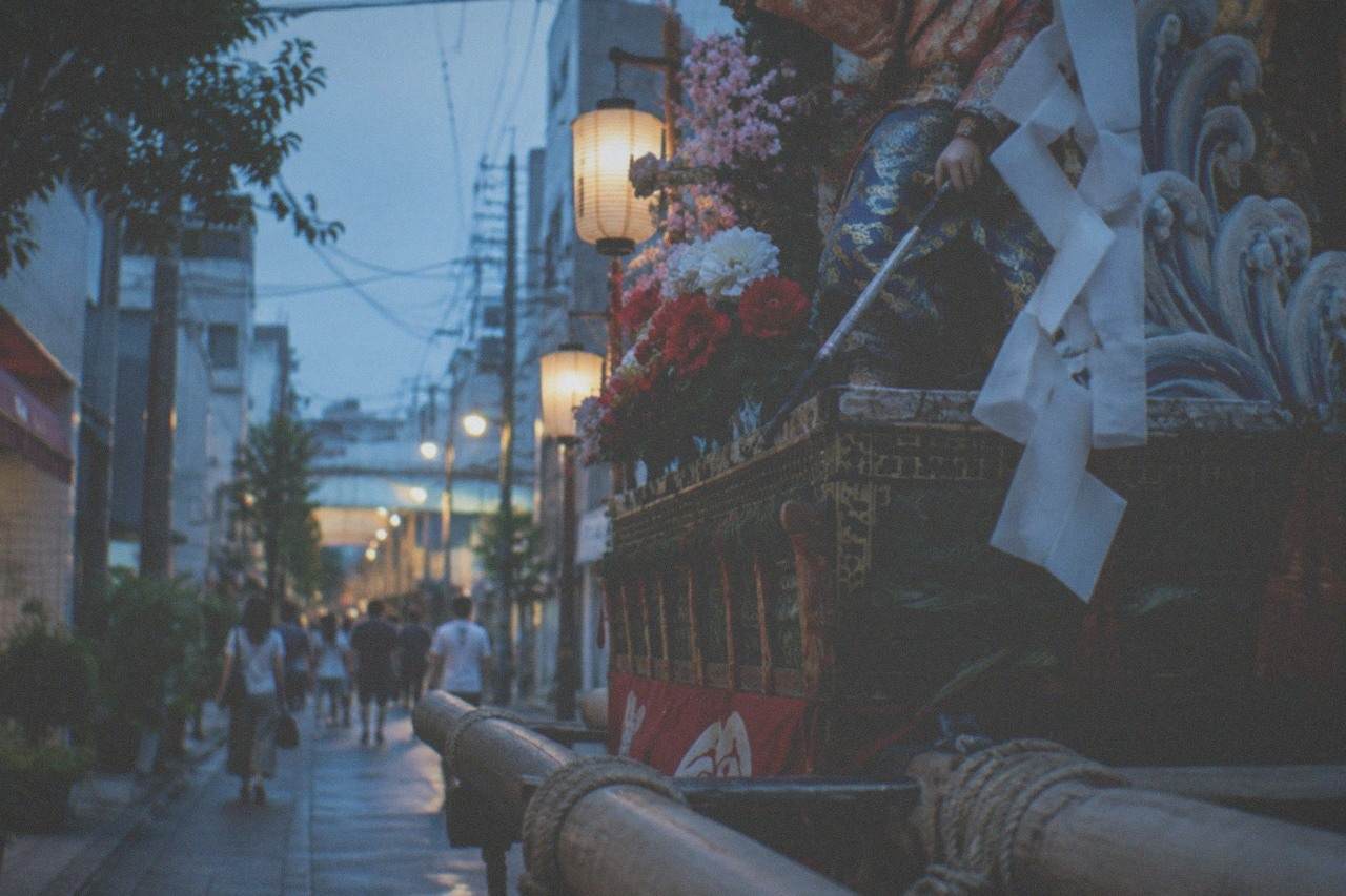Ornate decorated Yamakasa float displayed on a Hakata street at dusk