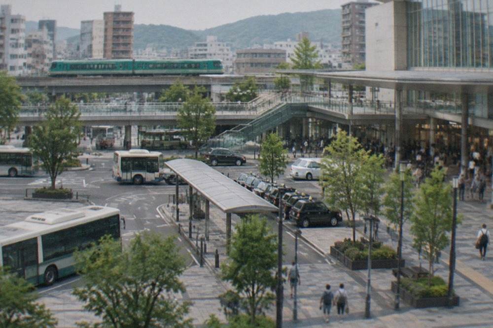 A limited express train on a green Kyushu rail line passing rural hills