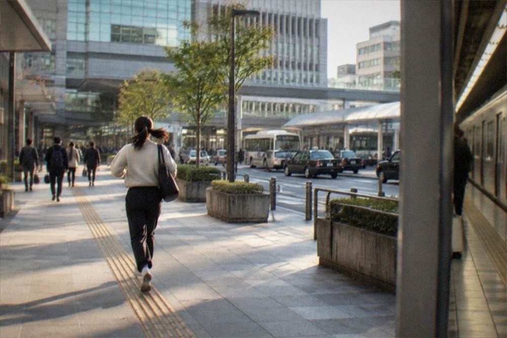 A subway platform in Fukuoka with a train arriving
