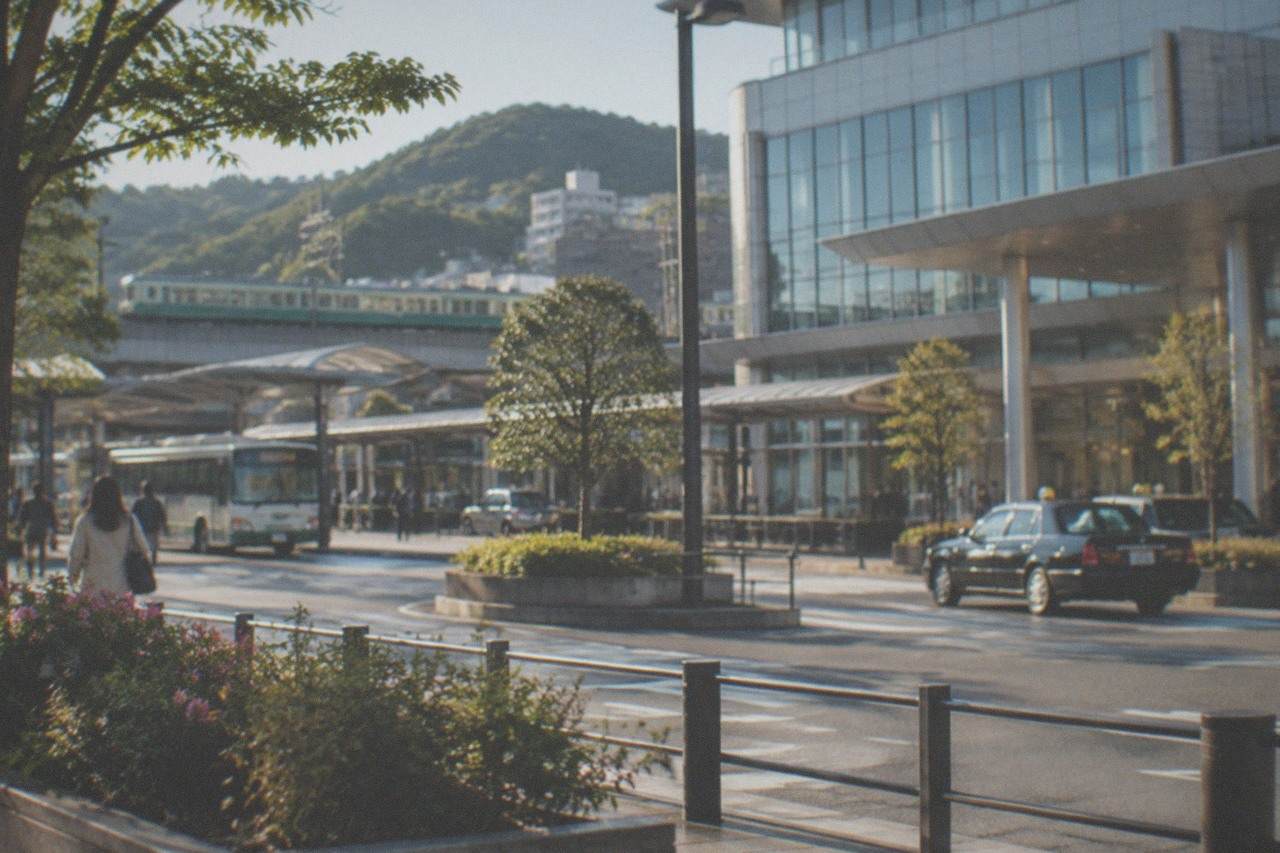 A limited express train on a green Kyushu rail line passing rural hills