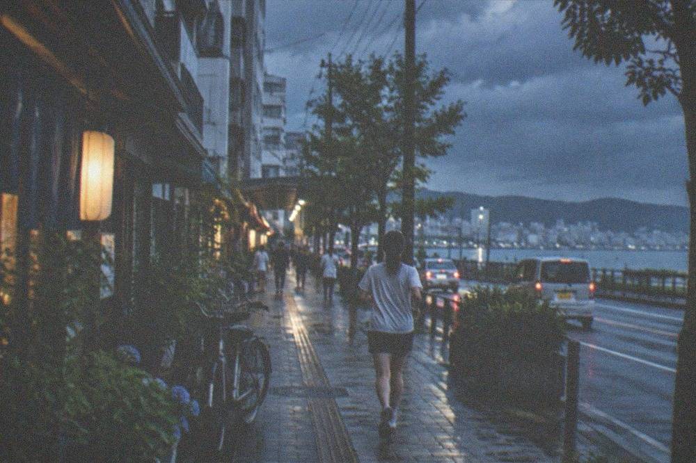 Dark storm clouds over a coastal city skyline in summer
