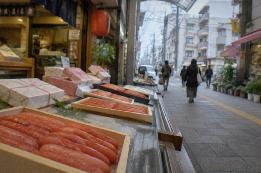 Depachika food floor counter with mentaiko trays and paper gift wrapping