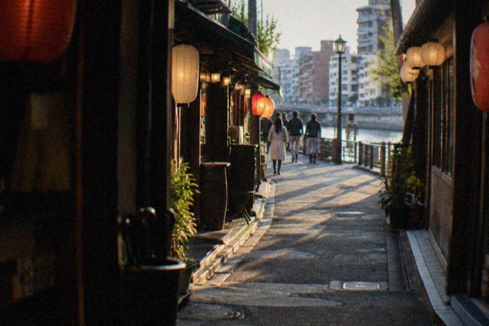 A narrow lantern-lit alley of bars and restaurants in the Nakasu entertainment district