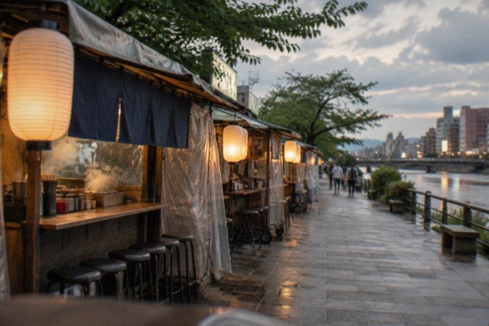 Empty riverside promenade in Nakasu with yatai stalls shuttered under grey skies