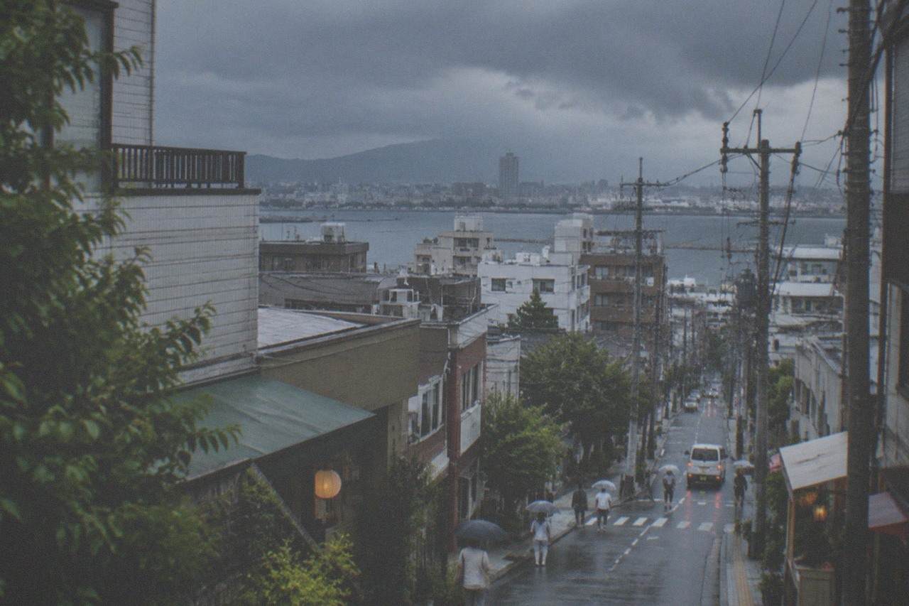 Dark storm clouds gathering over Hakata Bay and the Fukuoka city skyline