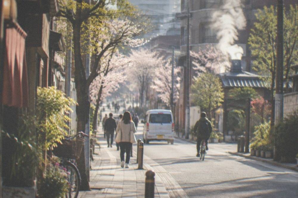 Steaming hot spring vents and clouds in a Japanese onsen town