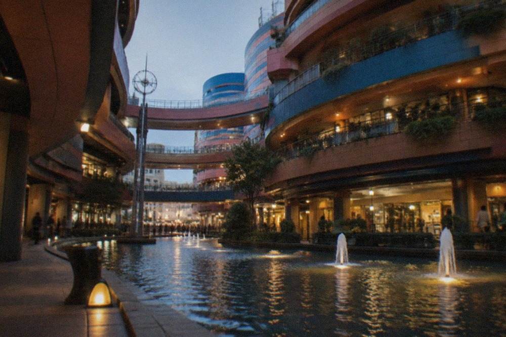 Canal City Hakata at dusk with the artificial waterway lit by warm lamps between shopping buildings