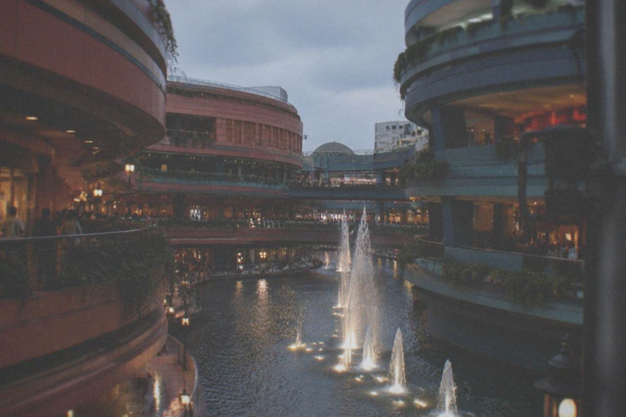 Canal City Hakata at dusk with the artificial waterway lit by warm lamps between shopping buildings