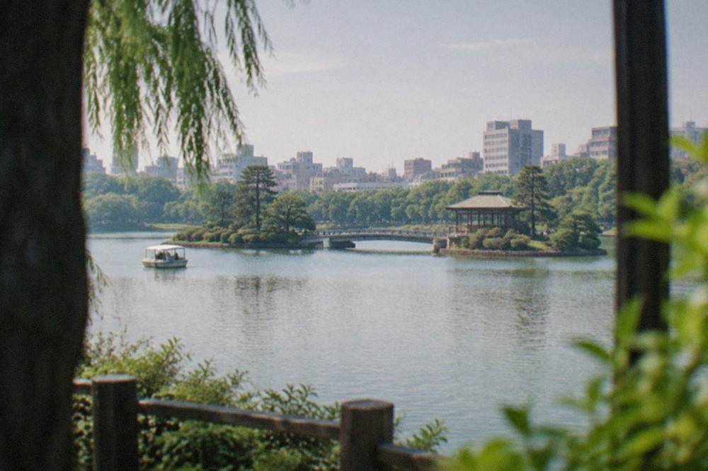 Ohori Park lake with the Japanese Garden and city skyline beyond, seen on a clear morning