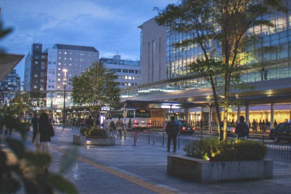 Modern hotel district around a large railway station with wide pedestrian decks